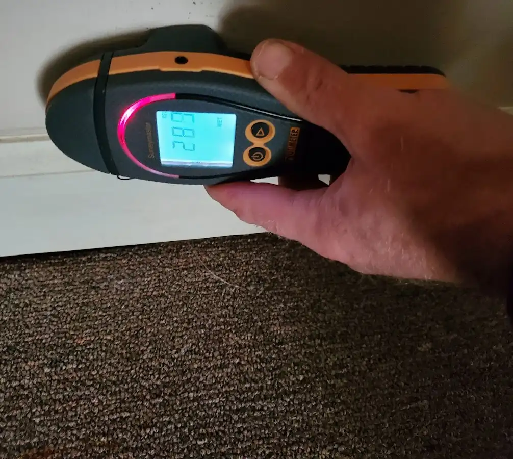 Moisture detection at baseboard during Storm Damage Restoration in Dobbs Ferry